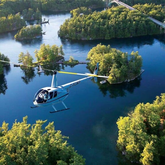 1000-Islands-Helicopter-over-blue-water